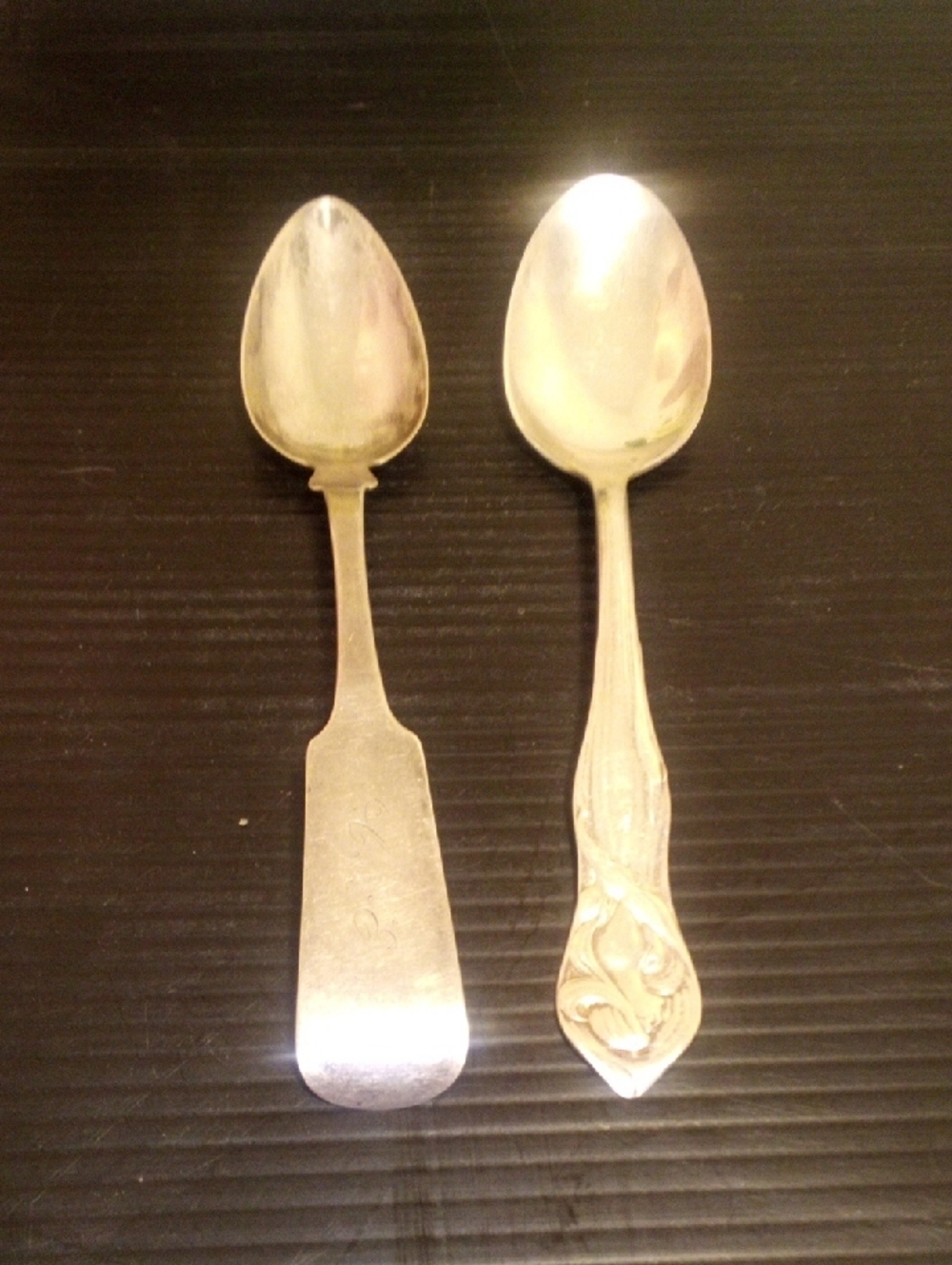 Pair of Silver-Tone Serving Spoons with Decorative and Plain Handles